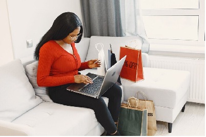a black hot girl with computer and credit card 